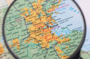 Magnifying glass showing the map of Boston